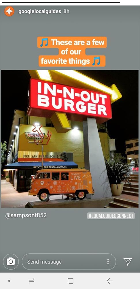 A screenshot of @PennyChristie and @kwiksatik in front of the In-N-Out Burger sign, carrying a cutout of a van, posted to Instagram by a fellow Local Guide.