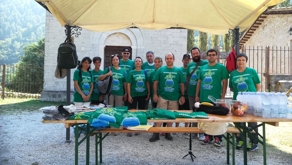 Caption: A photo of Ermes and other Local Guides wearing a green T-shirt with the Local Guides Clean the World campaign logo and posing for a photo before a clean-up. (Courtesy of Local Guide @ermest)