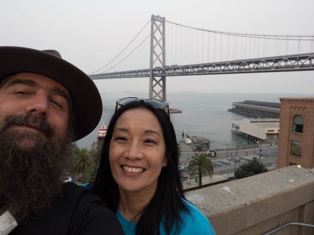 Caption: A selfie of Paul and Karen in front of the Oakland Bay Bridge in San Francisco, California. (Local Guide @PaulPavlinovich)
