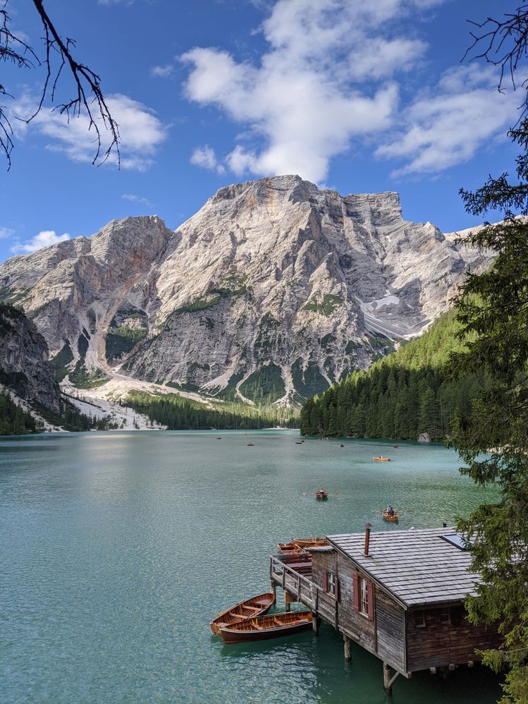 Caption: A photo of Lake Braies, the start of Alta Via 1 hiking trail, against the backdrop of the Dolomites mountain range in Italy. (Local Guide @FlavioDA)