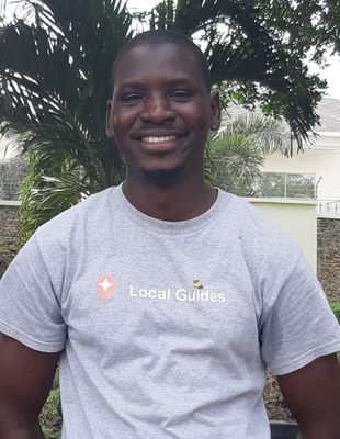 Caption: A photo of Sagir wearing a Local Guides t-shirt.