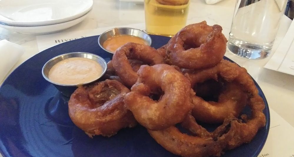 Caption: A photo of the onion rings from North River Public House. (Local Guide Tyler Groenendal)
