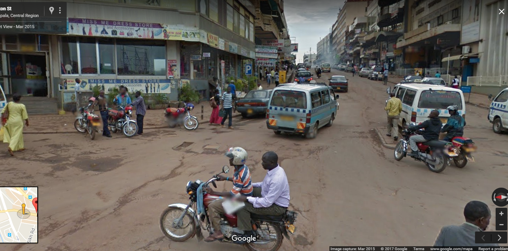boda boda carrying a man on luwum street - google street view