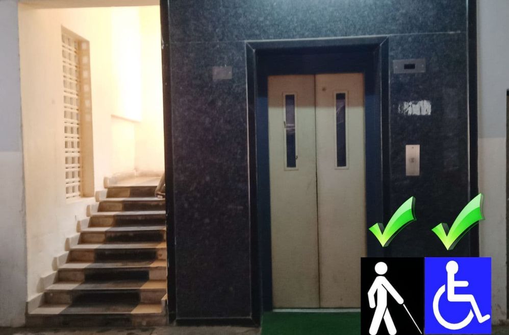 Caption: Steps for Normal People and Elevator for Wheelchair.