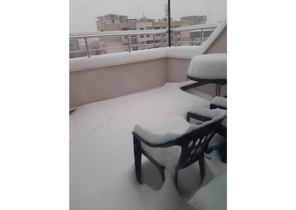 Caption: A photo of a terrasse in Sofia, Bulgaria, covered with snow. (Local Guide @BorrisS)
