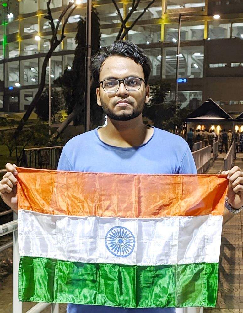 Caption: A photo of Pritish holding the flag of India. (Courtesy of Local Guide @PritishB)