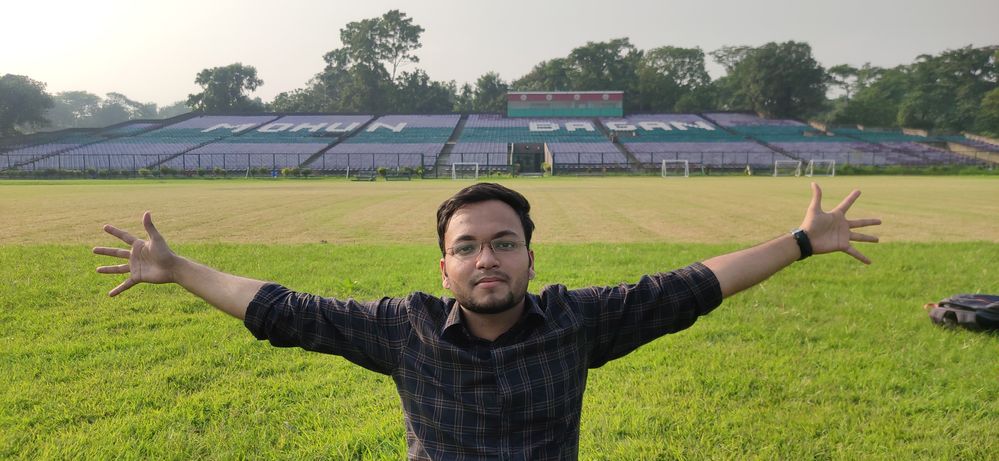 Caption: A photo of Pritish with outstretched arms at his favorite place, the stadium of the Mohun Bagan Athletic Club in Kolkata. (Courtesy of Local Guide @PritishB)