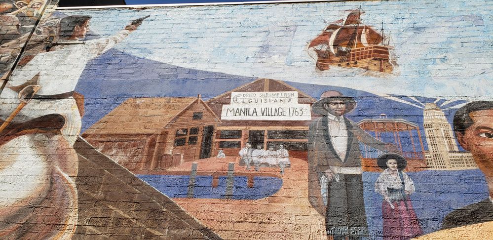Caption: A photo of a wall mural illustrating Filipino-American history. (Local Guide Florence)