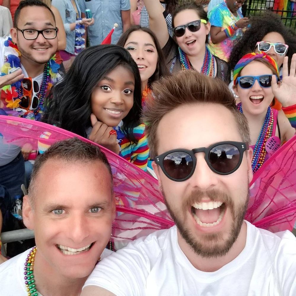 Caption: A photo of Local Guide Ralph Hickman (front right) and friends celebrating at a previous Pride festival.