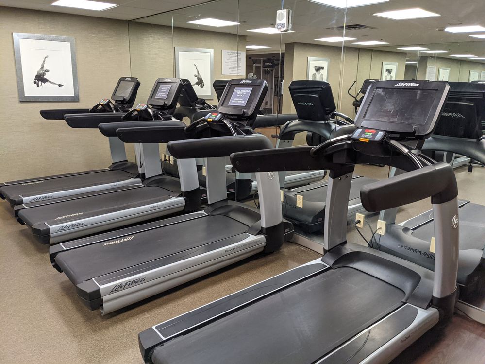 Caption: A photo of treadmills at the Marriott Park Ridge hotel gym that shows the machine type and spacing of available machines due to COVID-19.  (Local Guide @TraciC)