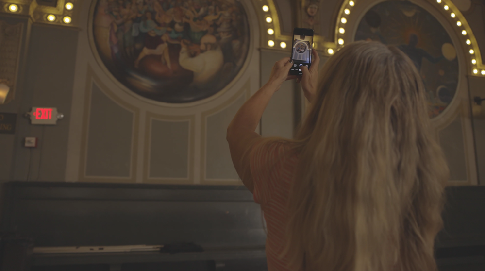 Caption: A photo of Kimbra taking a photo at The Crystal Ballroom in Portland to share on Google Maps.