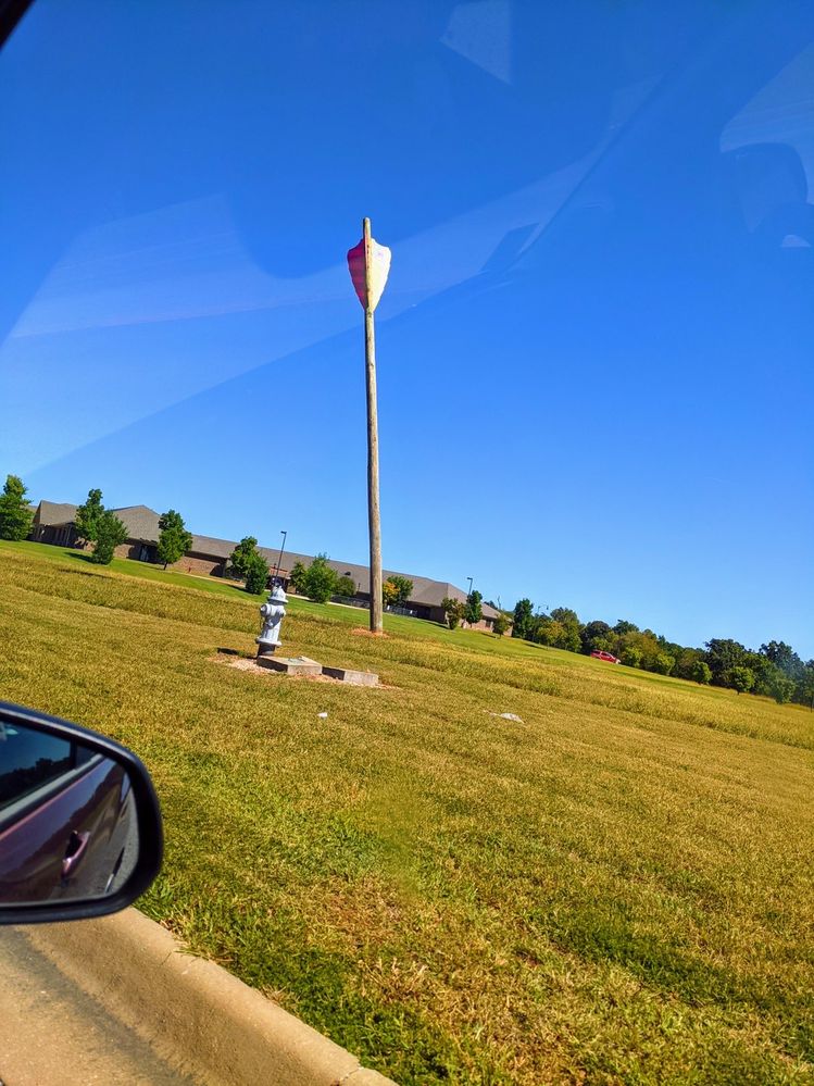 A photo of Bentonville, Arkansas’s huge Native American arrow art.
