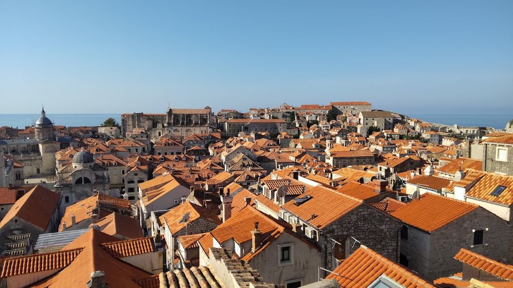Caption: A photo of the Old Town of Dubrovnik and the Adriatic Sea in the distance as seen from the Walls of Dubrovnik in Croatia. (Local Guide @Annachan16)