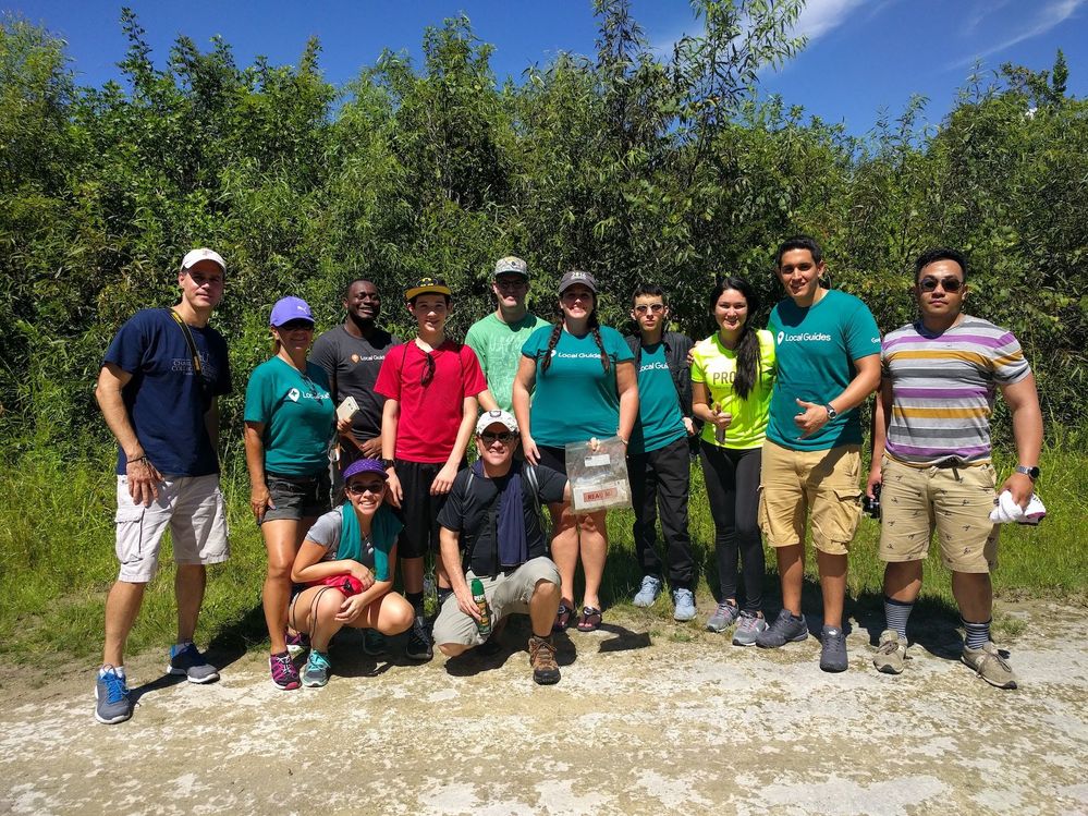 Caption: A photo of Local Guides standing in front of trees at Everglades National Park, including @SP31 with Traci in the center.