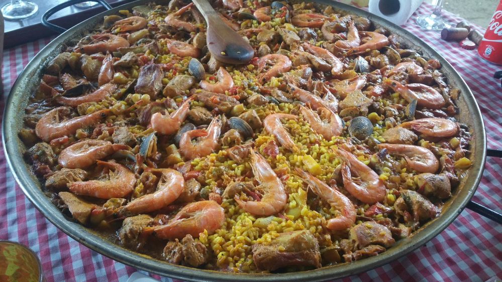 Caption: Paella  a typical Spanish food made with rice, seafood and meat. It´s  cooked in a paellera