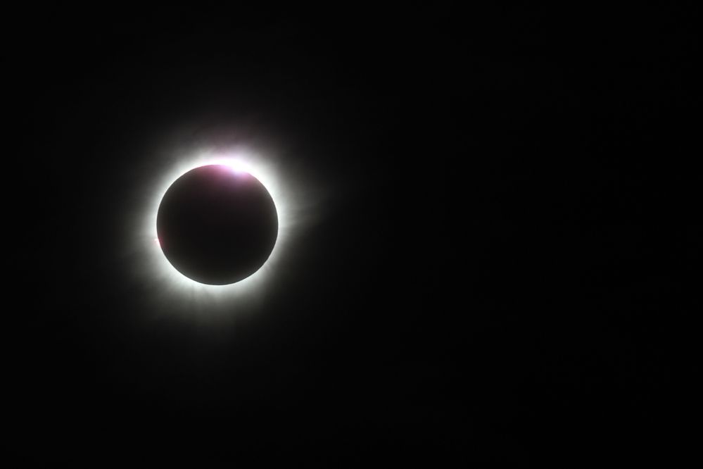 Low Angle View Of Solar Eclipse Against Clear Sky (Getty Images)