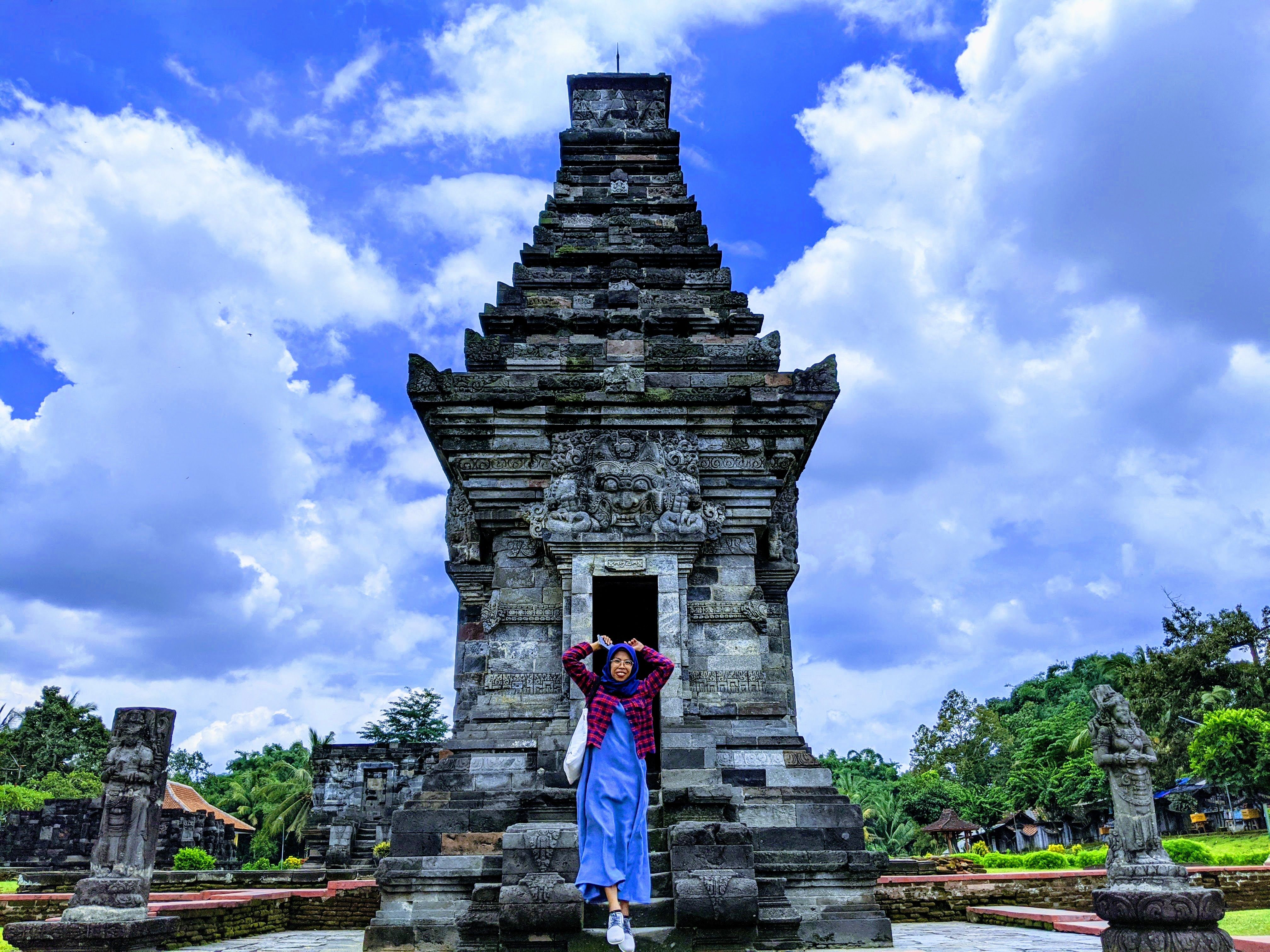 caption: A photo of I am jumping in front of Penataran Temple (Local guides Choirul Musthofa)