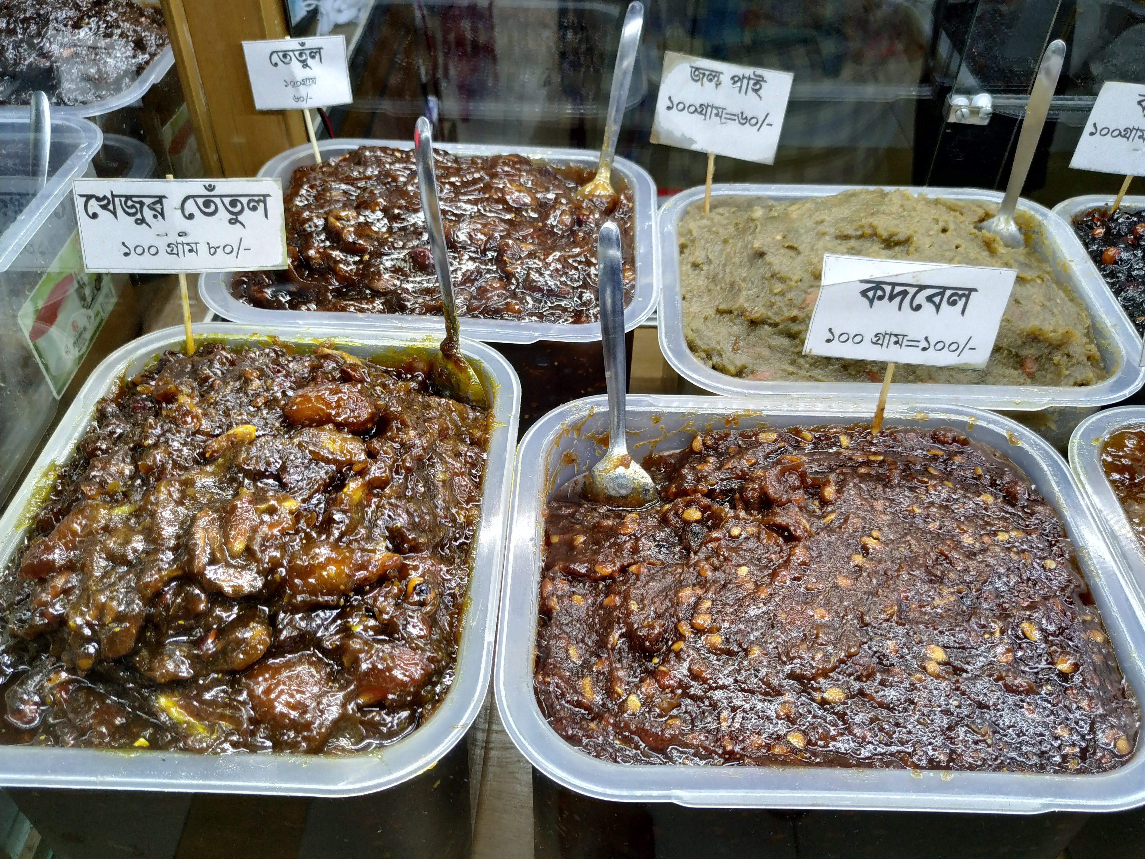 Top left: Tamarind pickle, Top right: Mashed Olive Pickle, Bottom right: Wood apple pickle
