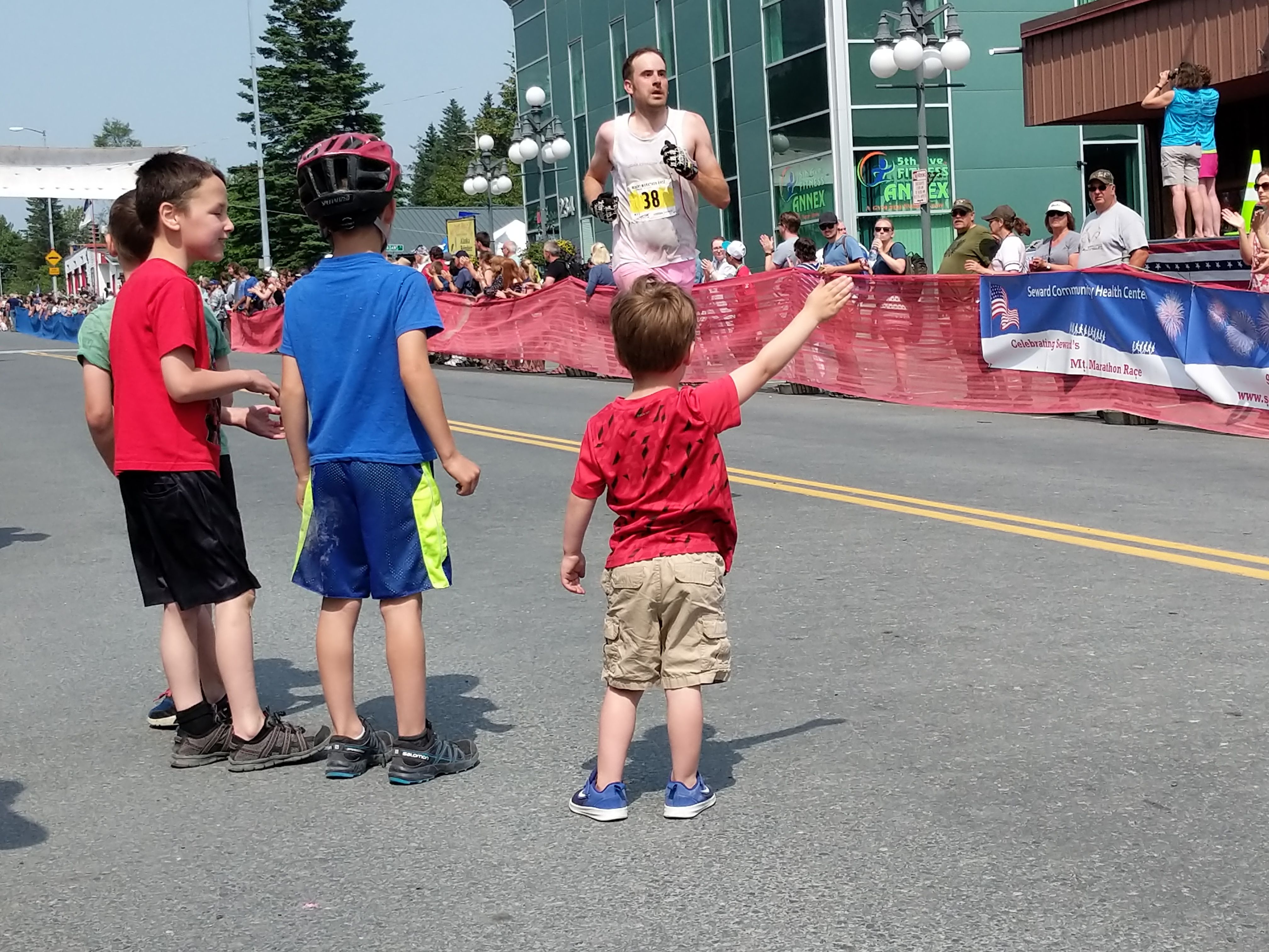 Local little boys welcoming the runners at the end of the race