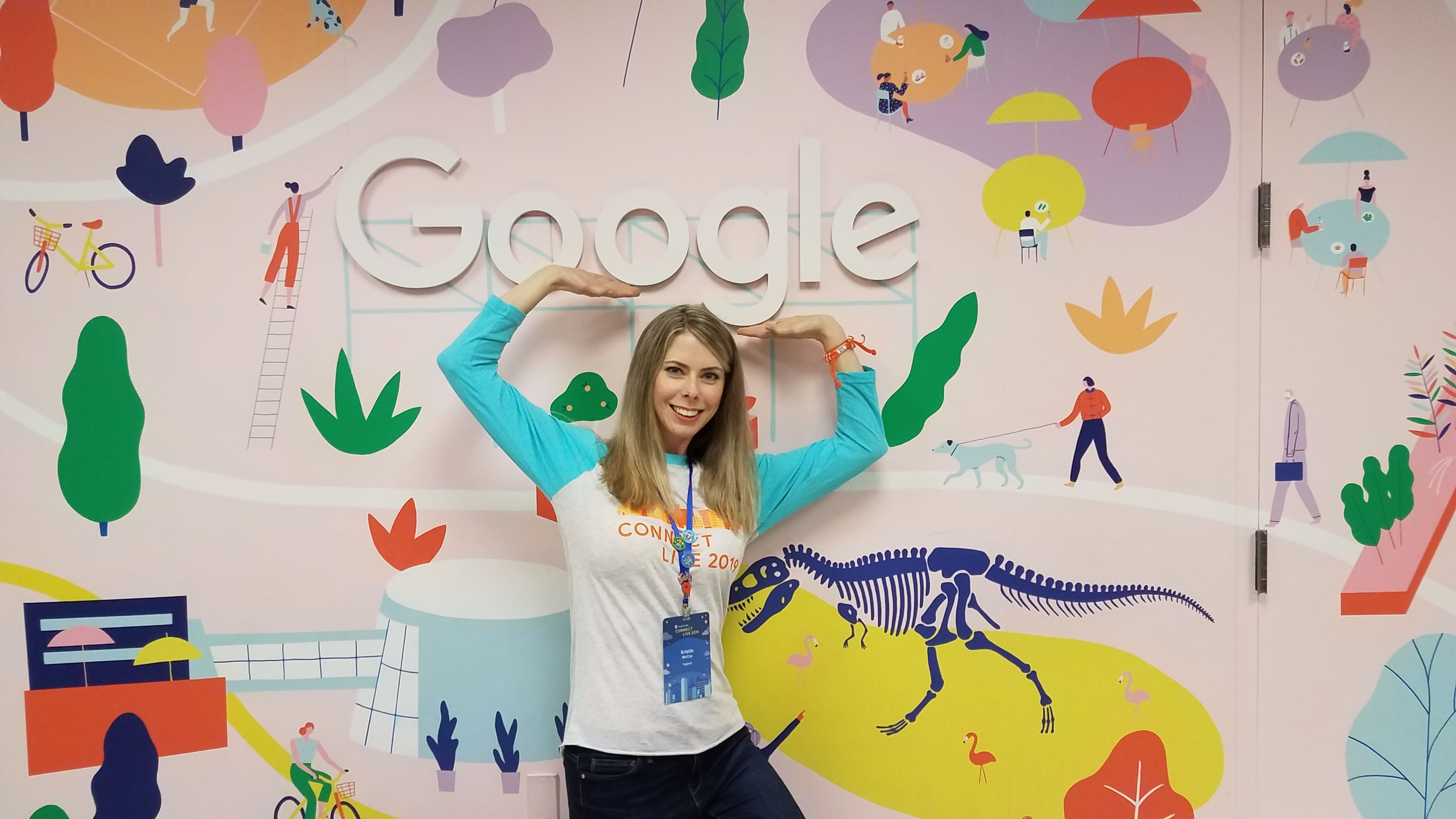 TheRealKristin holds up the Google logo sign