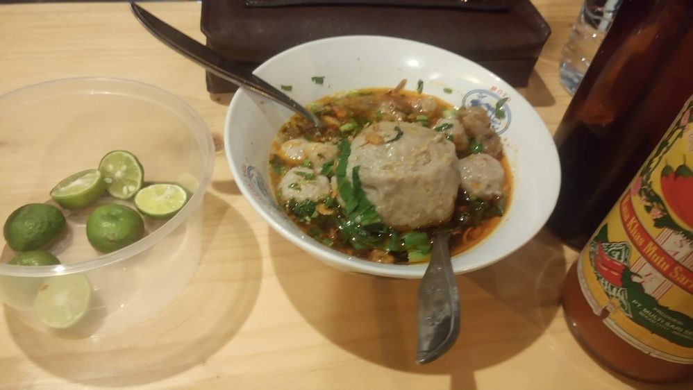 Bakso, popular food  from Indonesia, meatball with noodles and vegetables, recommend hot spicy taste with sauce and sambal