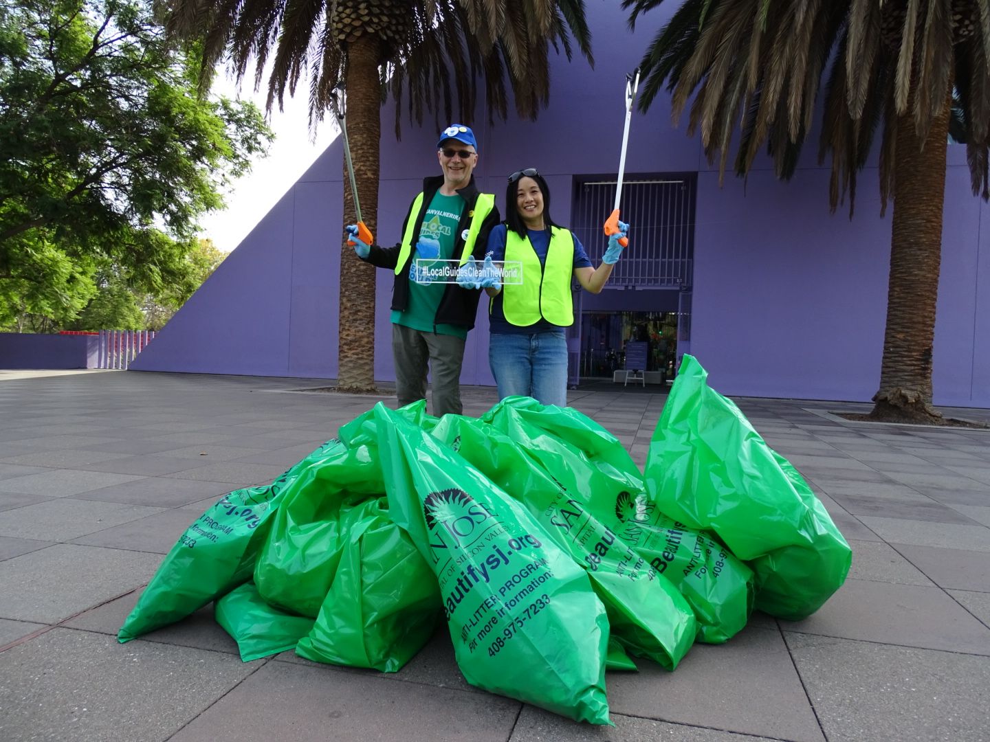 Caption: Local Guides @KarenVChin and @ermest  behind the bags of plastic collected at the Children's Discovery Museum of San Jose