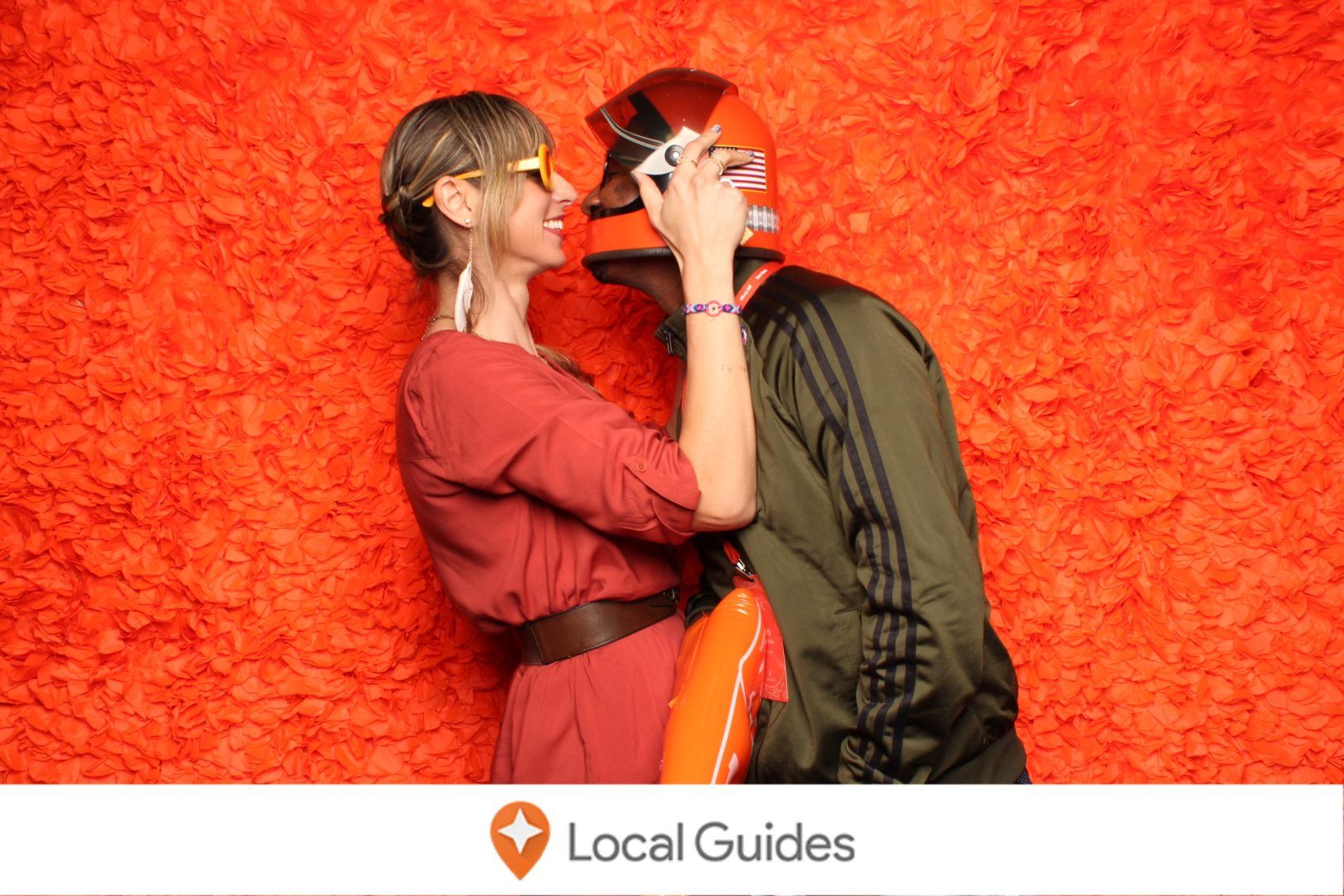 Caption: A photo of Mark and me embracing in front of an orange wall at Connect Live 2018.