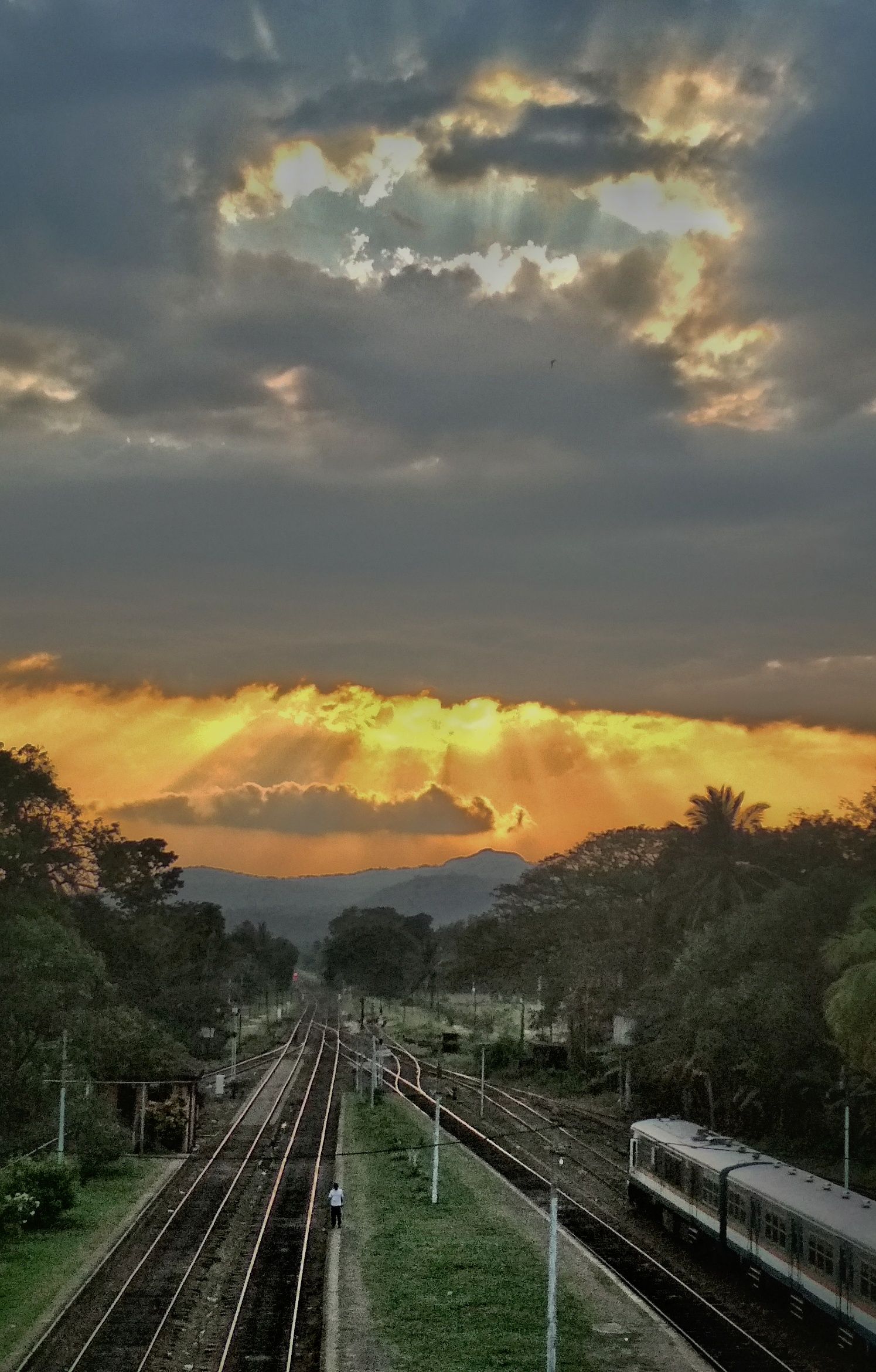 The view of sunset from the overhead bridge above the Railway station at Polgahawela ,Sri Lanka
