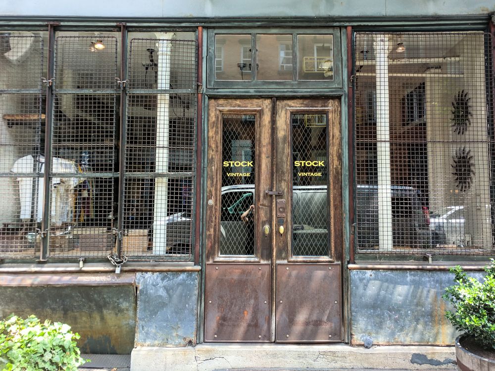 Caption: A photo of the exterior and door of Stock Vintage, a vintage clothing store in New York City. (Wendy George)