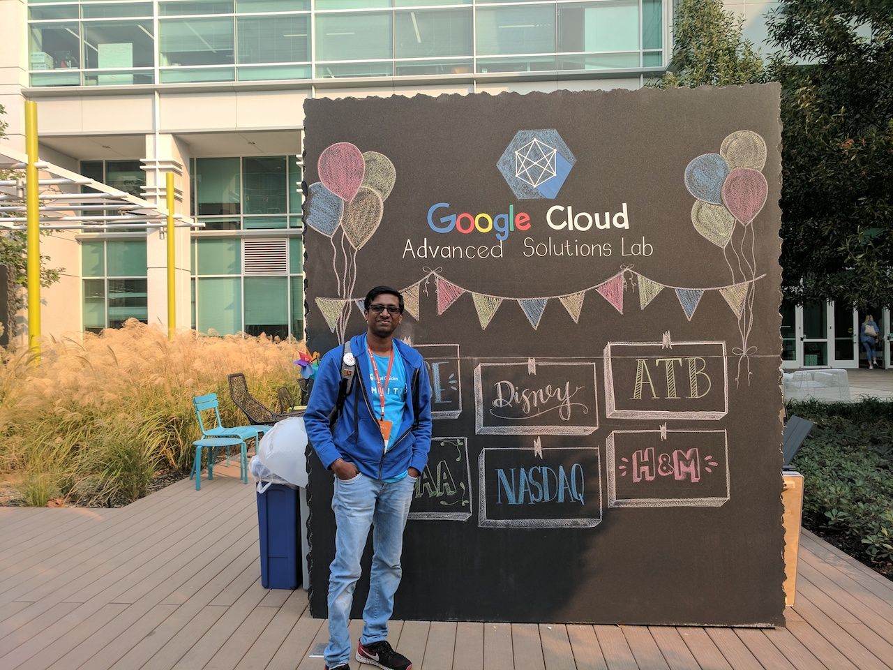 A photo of Local Guide Ilankovan standing in front of a Google Cloud Advanced Solutions Lab sign