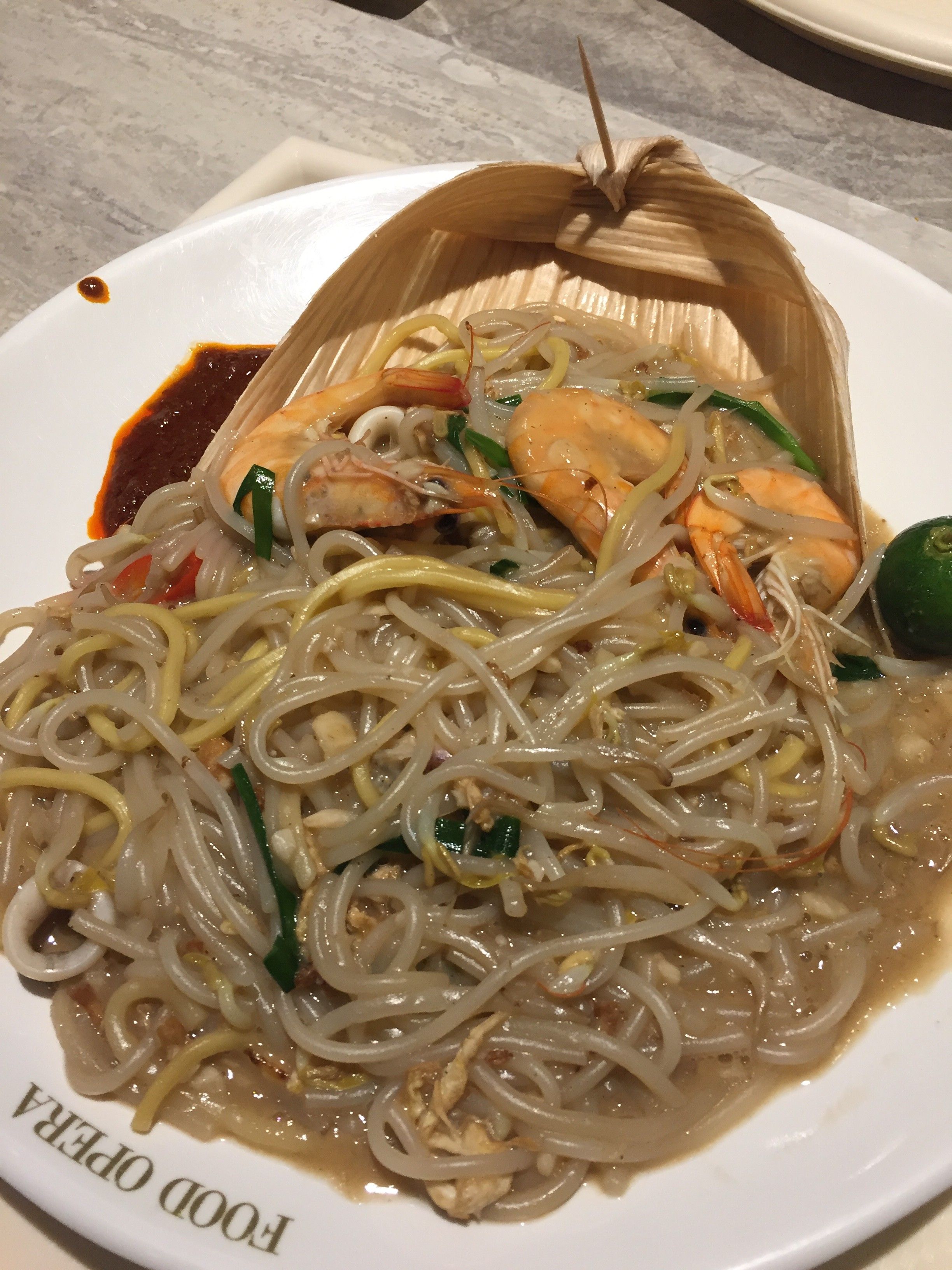 Caption: A photo of the prawn Hokkien mee dish from Thye Hong Eateries Pte. Ltd in Somerset, Singapore on a plate. (Local Guide @AngieYC)