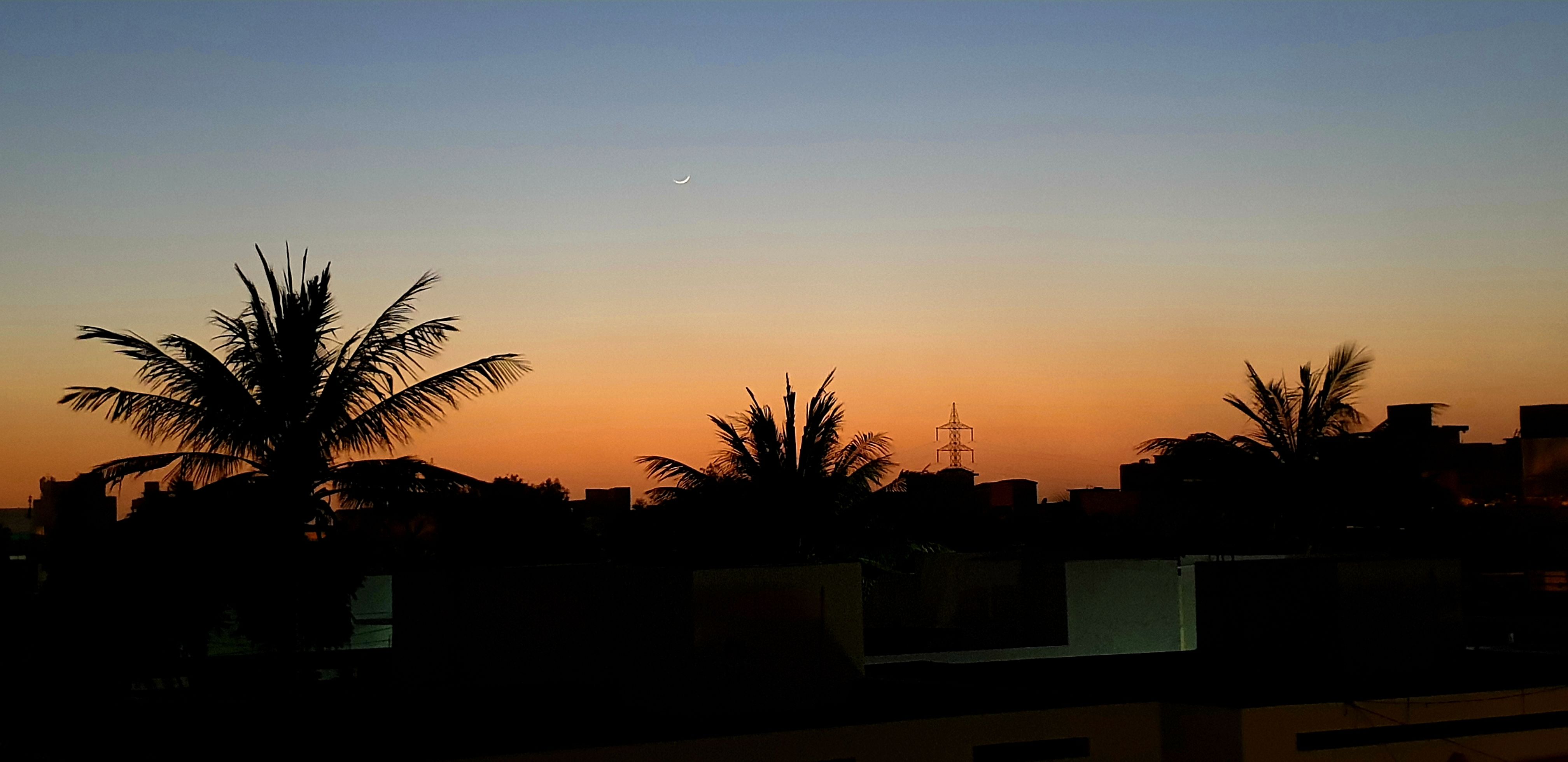 Karachi: New moon near sunset, from window of my room.