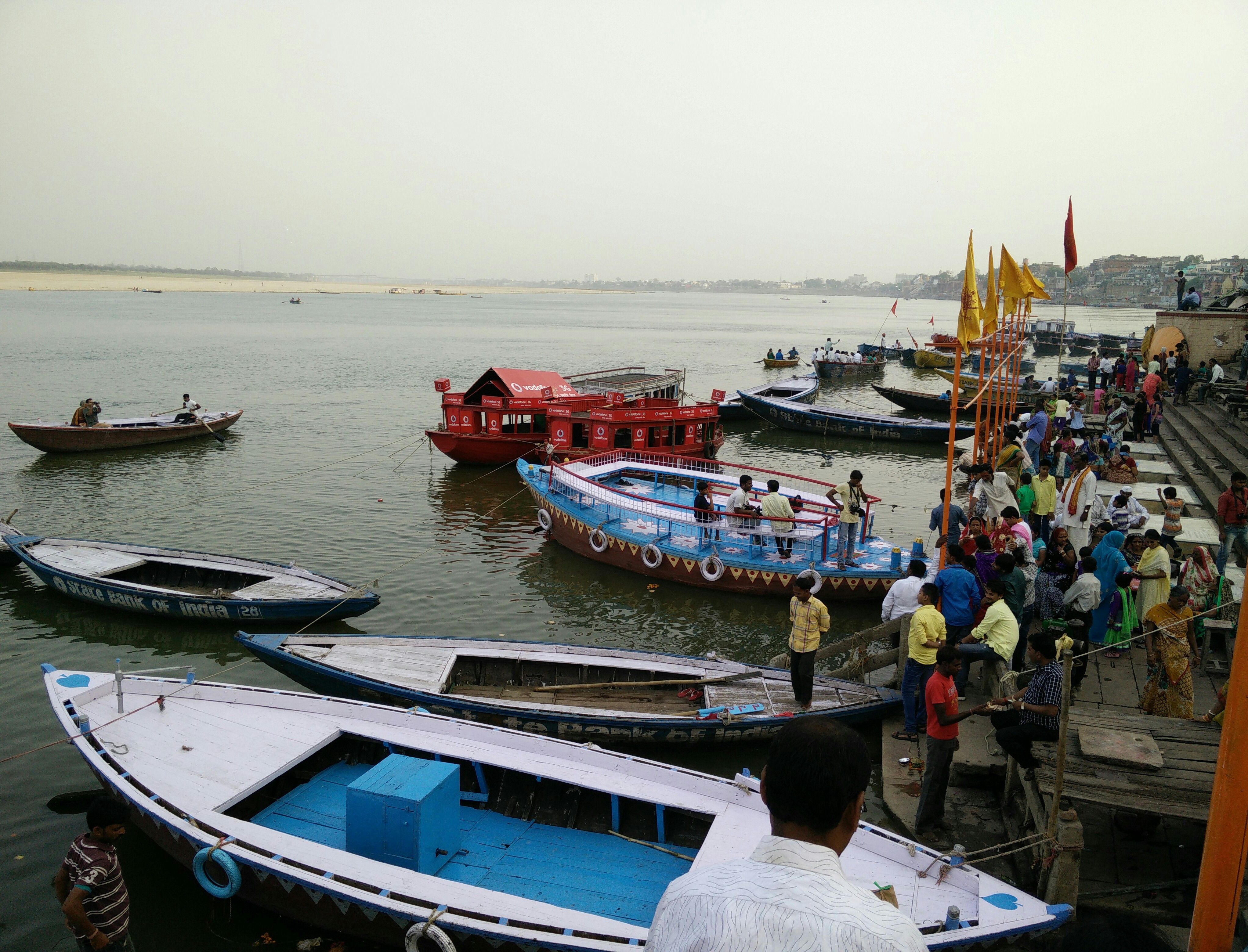 Boats with boatman on hire at the ghats.