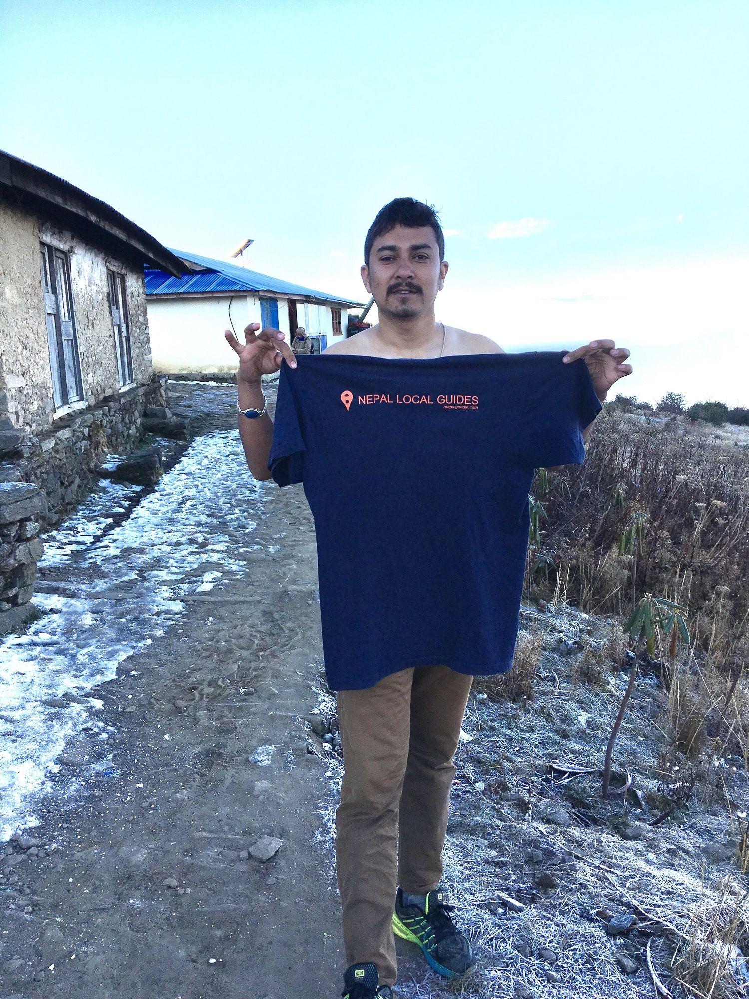 Me: showing Nepal local guide T-shirt, Ice at Back: 4000m (13100ft) from sea level