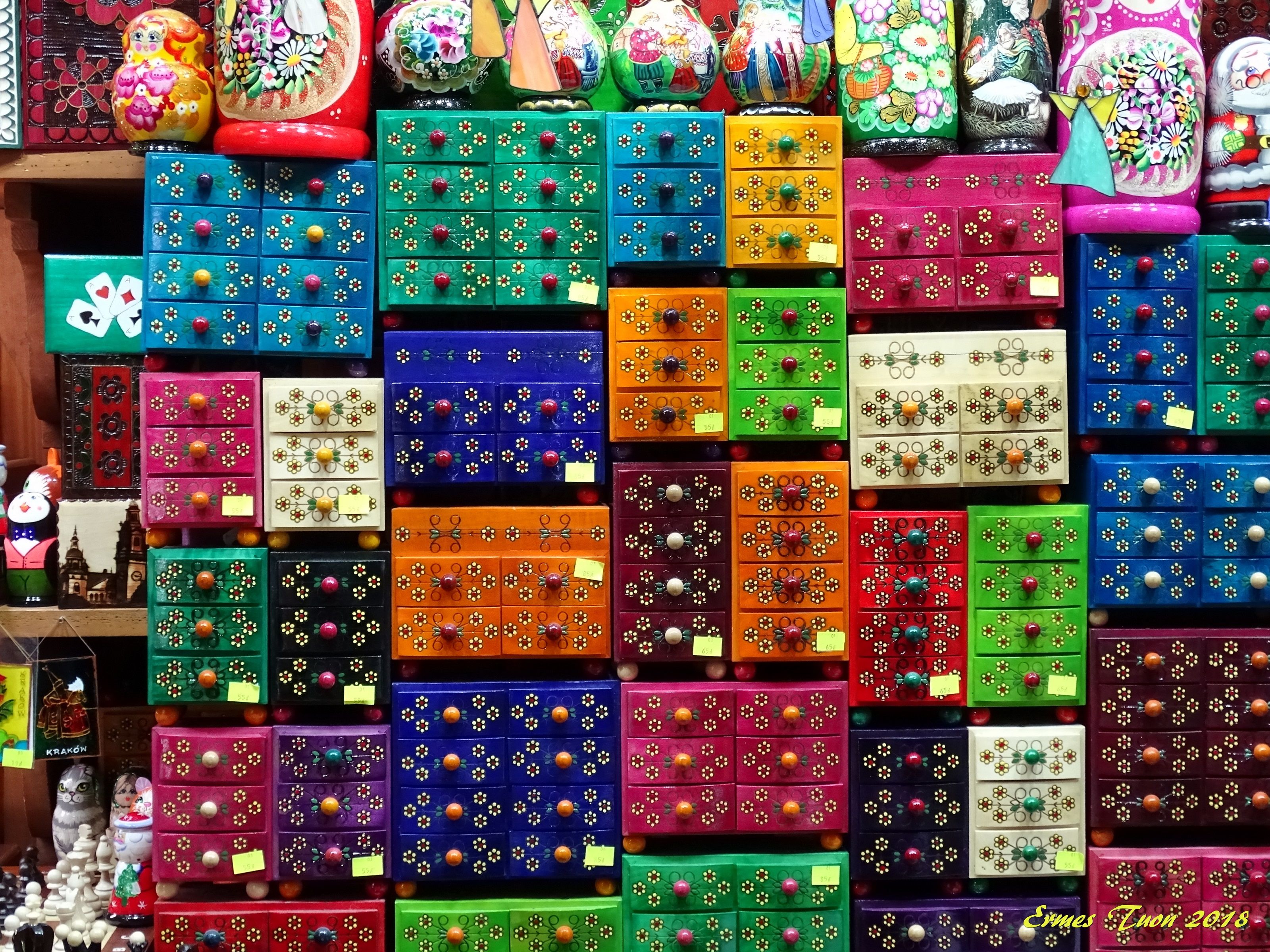 Caption: Coloured wooden boxes at Sukiennice market - Krakow (PL)