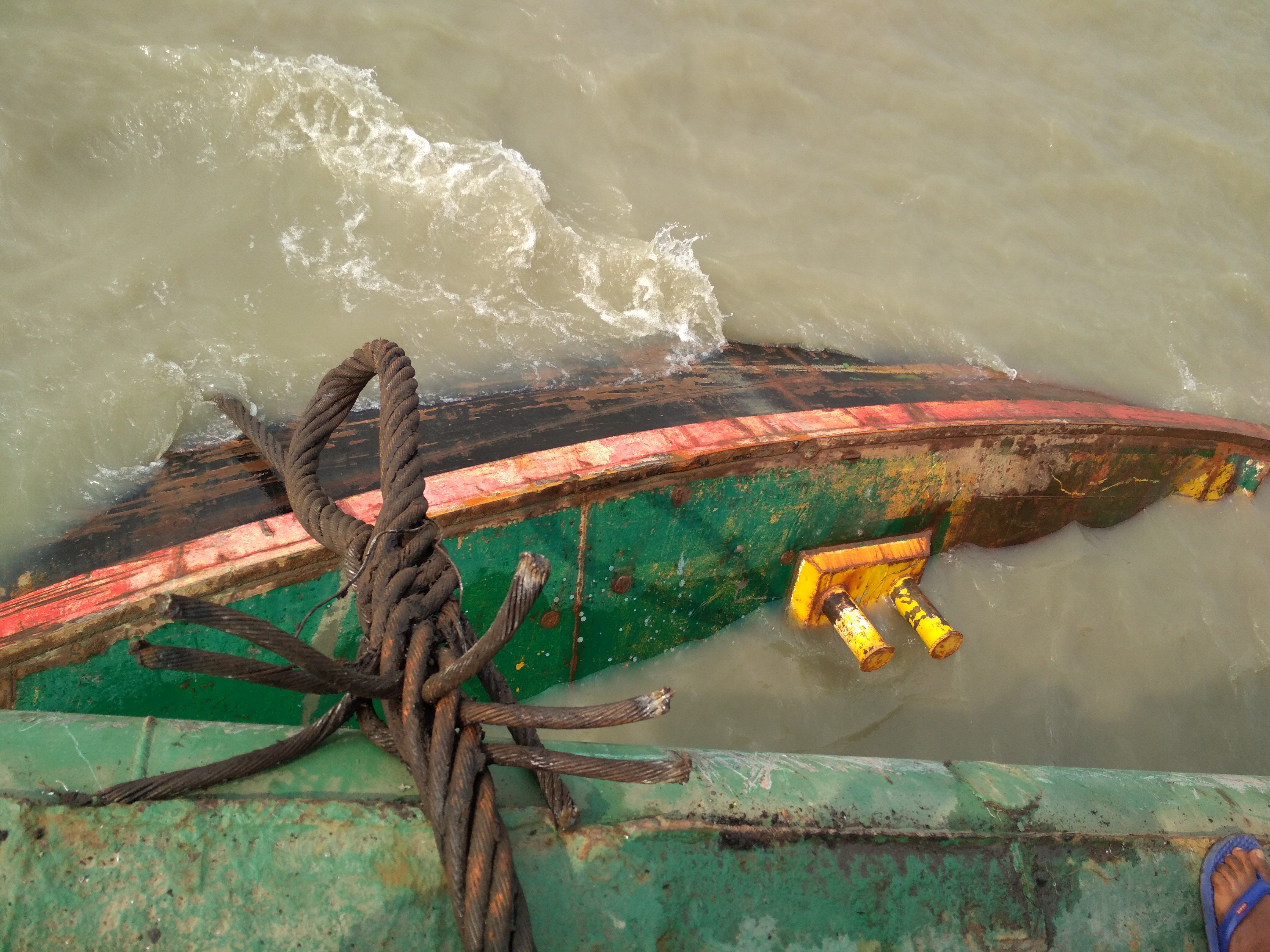 Refloating a cargo boat. Photo taken from the top of a salvage barge at karnaphuli river mouth.