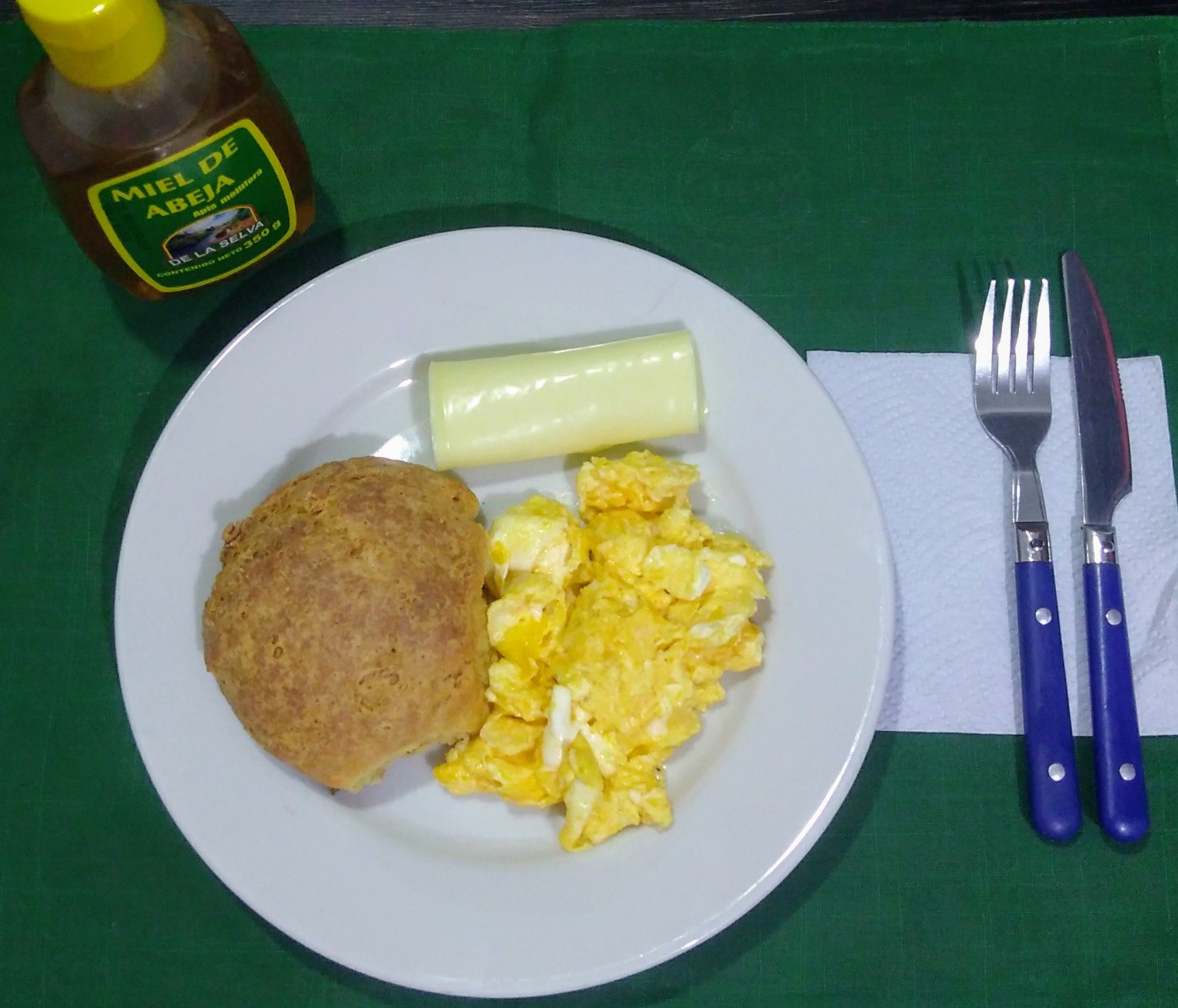 Honey, scone, cheese and scramble eggs