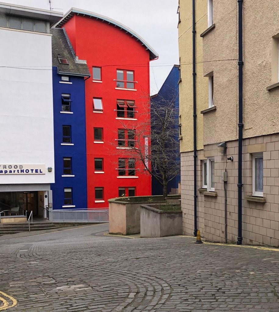 Two splashes of color make these buildings stand out. Edinburgh, Scotland