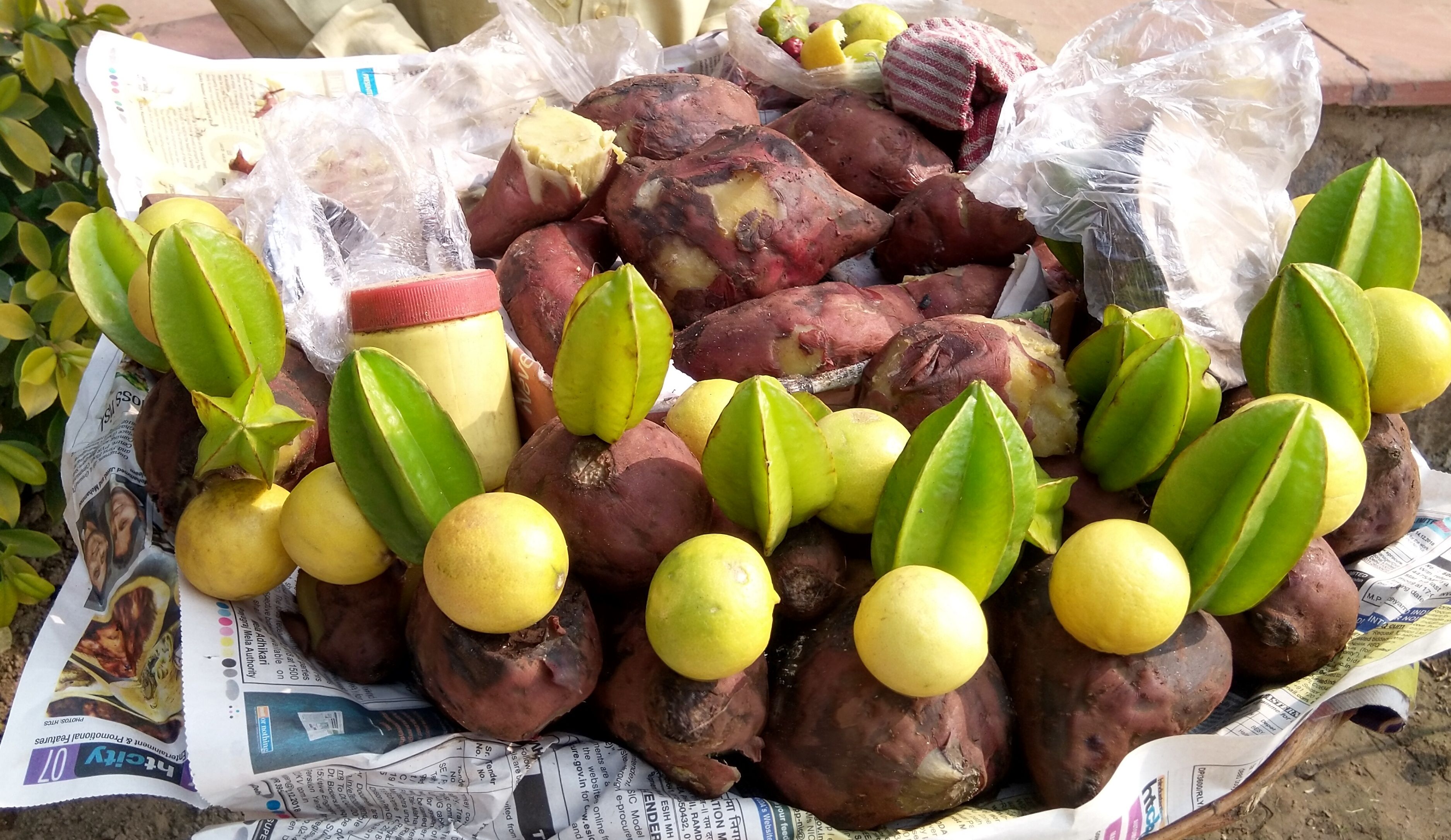 These are sweet potato mix chat with lime & spices. The green one is star fruit or better known as Carambola. The sweet potato are boiled. It is very tasty any time food. Recipe is: Take some boiled sweet potatoes and cut into small pieces, add some lime juice with Salt and other spices you can add some star fruit juice also.