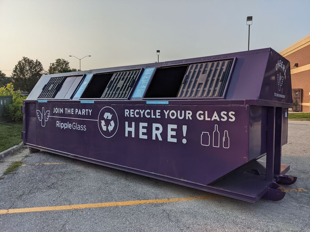 Caption: A photo of a violet container for recycling glass in Kansas City, Missouri. (Local Guide Alexander)