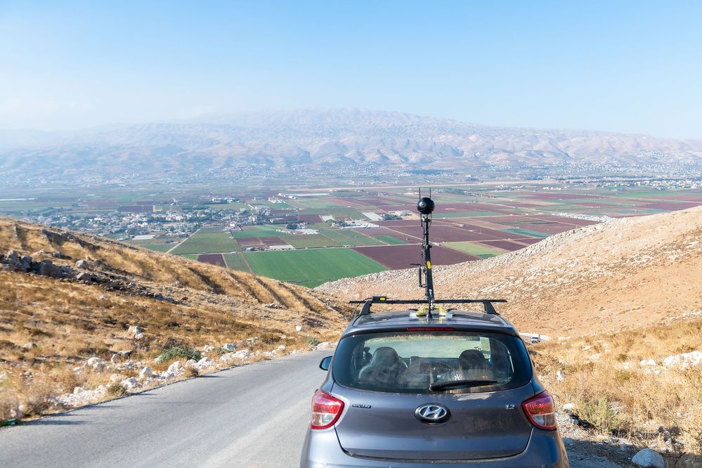 Caption: A photo of Paul’s car with a mounted 360 camera parked on a hill overlooking the Lebanese countryside. (Courtesy of Local Guide @PaulSaad1)