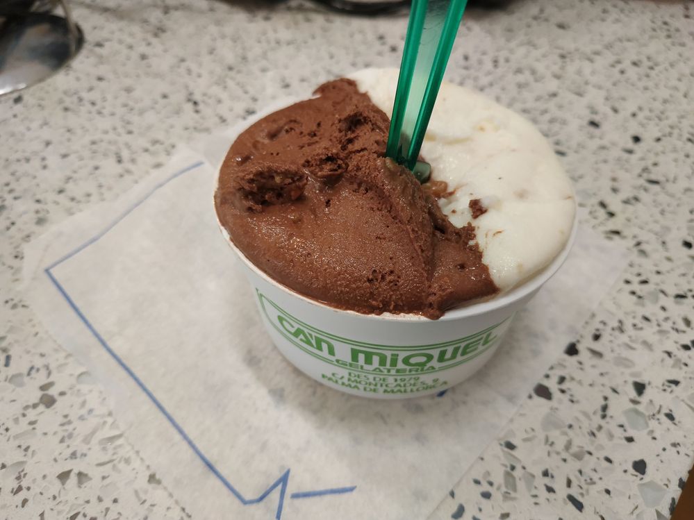 Caption: A photo of a cup with two scoops of ice cream, one of which is Roquefort Cheese, from Gelateria Ca'n Miquel in Palma de Mallorca, Spain. (Local Guide Flavio Karpinscki)