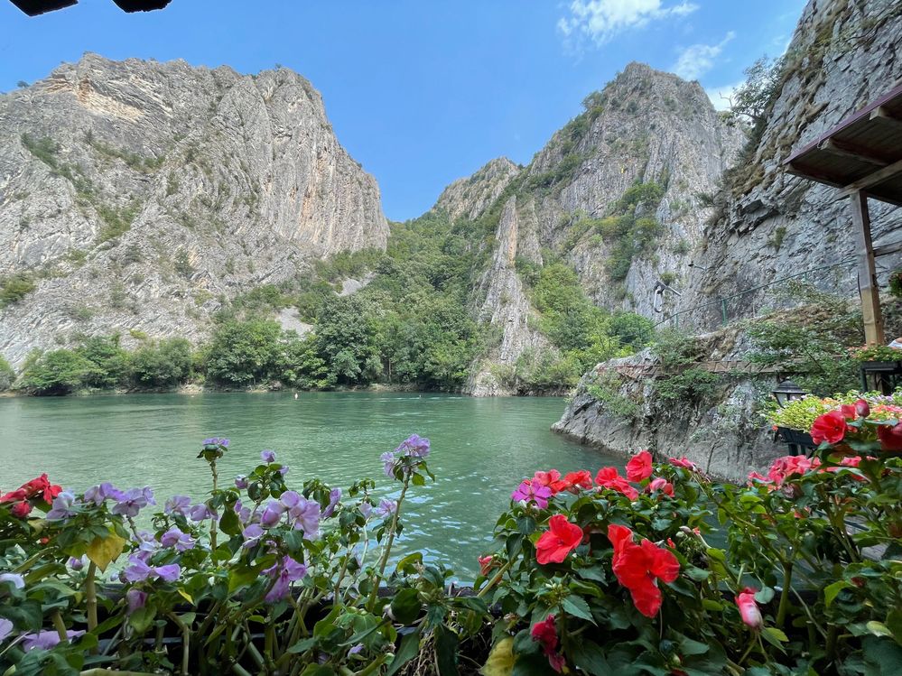 Caption: A photo of flowers and the green waters of Treska River with rock formations in the background. (Local Guide @EvaBar)
