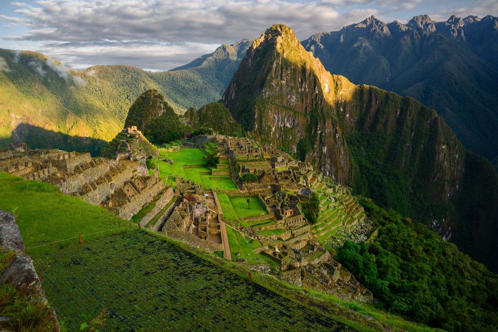 Caption: A photo of the ruins of Machu Picchu at sunset. (Local Guide Alex Garin)