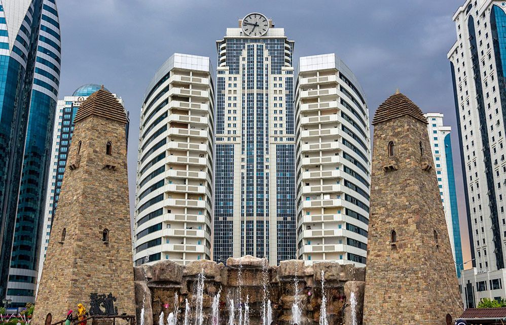 Connection of times. Watchtowers on the background of Grozny City.
