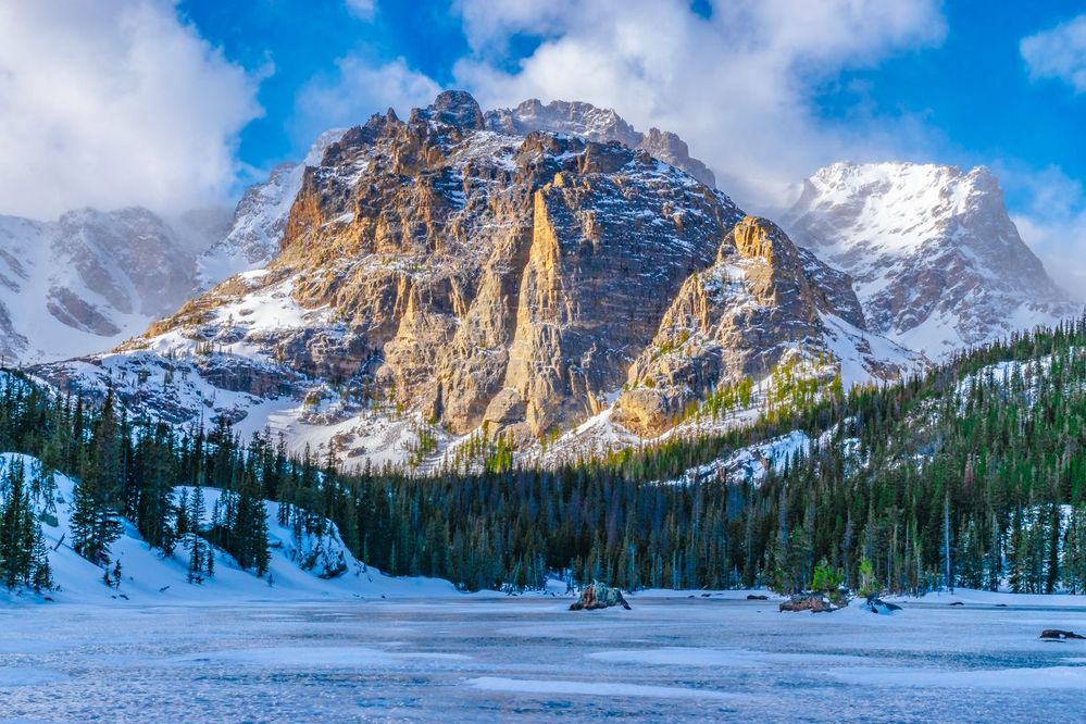 Caption: A photo of the frozen Loch Vale lake at Rocky Mountain National Park. (Courtesy of Local Guide Jeremy Janus)