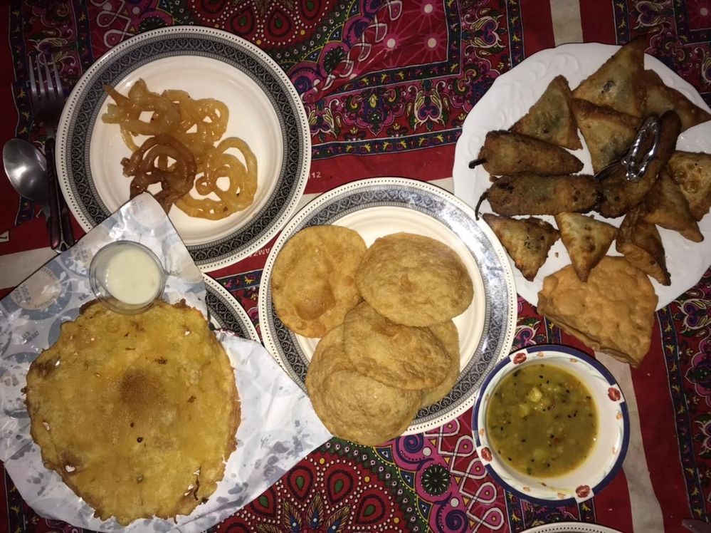 Malpura with other Iftar Food Items at my home's dining table