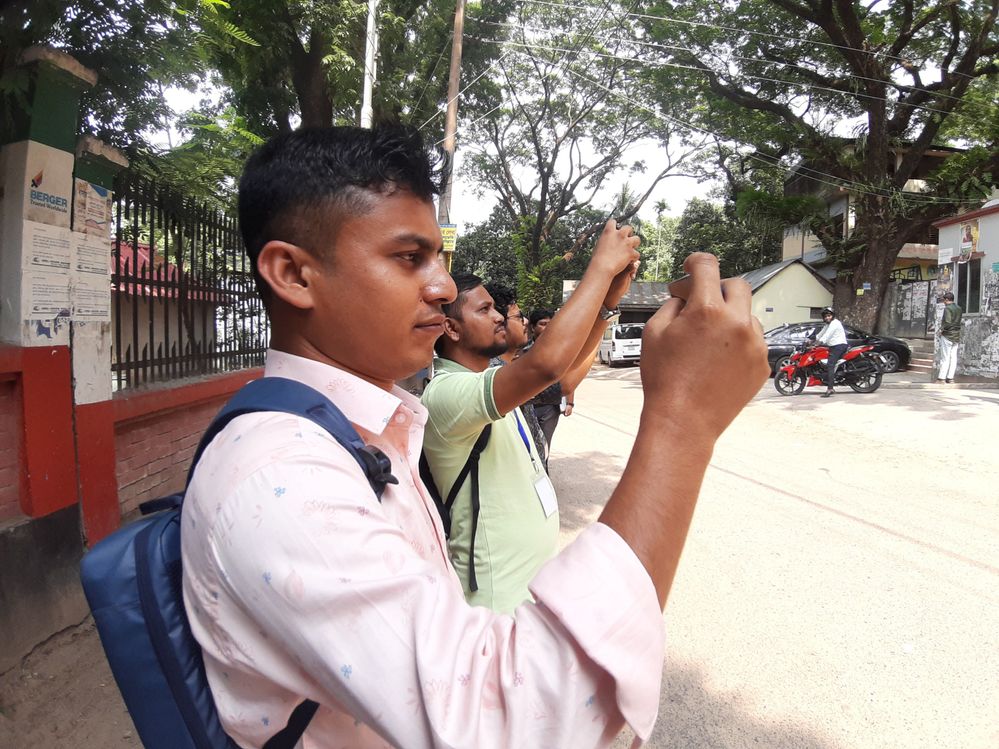 Caption: A view of mapping by meet up participants standing in front of Nazrul Institute Center while they were taking photographs