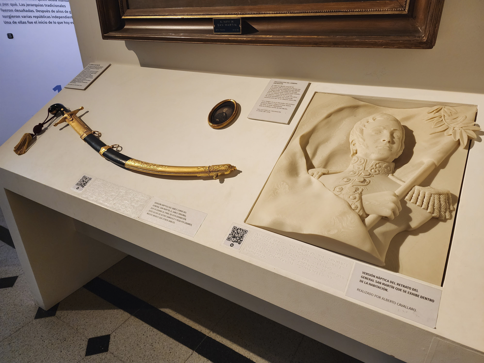 Caption: A replica of a sword and a 4d version of a painting for everyone to touch, and for visually impaired people to enjoy the exhibit like everyone should.