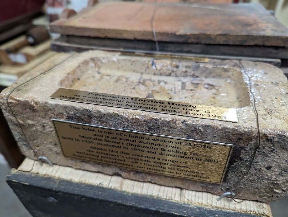 a "limited edition" and "substantial souvenir"" - picture of a brick with a plaque containing these words
